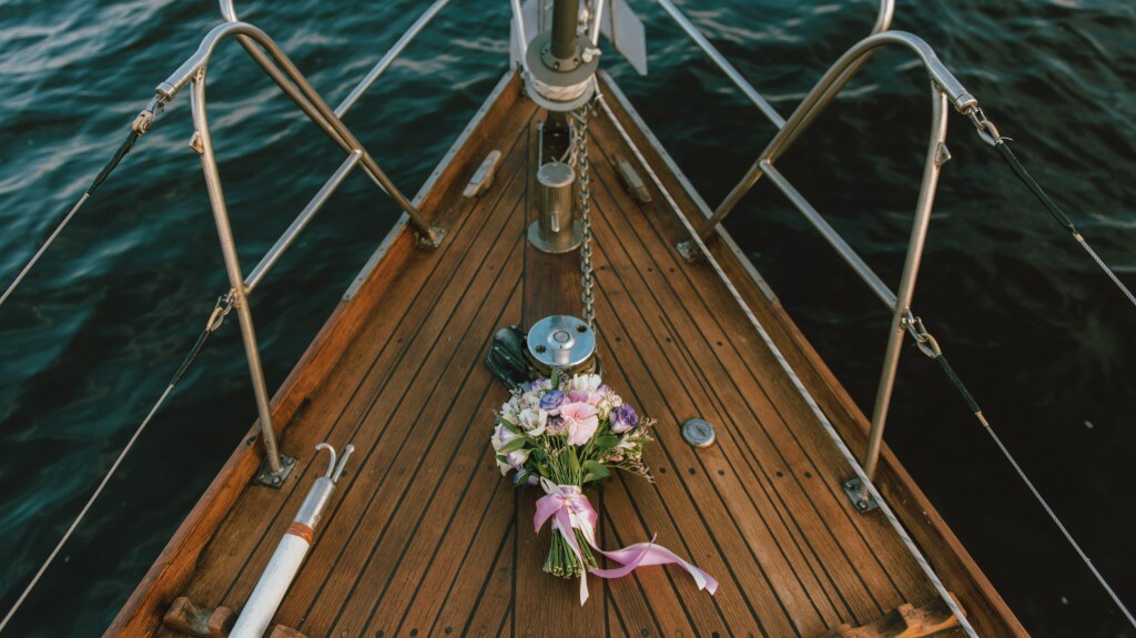 Engagement, wedding photography on a two-masted, classic sailboat